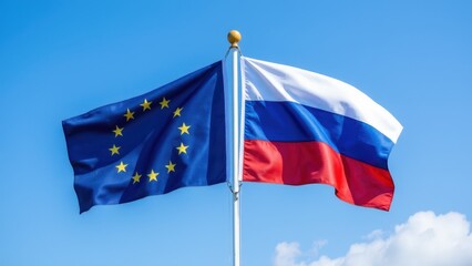 European union and russian flags waving together against blue sky