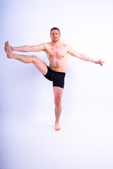 Obraz premium Portrait, happy man and bodybuilder with abs on studio background, backdrop and topless pride