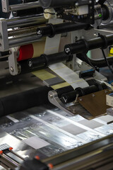 Industrial printing process in action inside a busy manufacturing facility