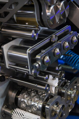 Fototapeta premium Close-up view of clean metal industrial dumpling and ravioli making machine in food processing factory or in modern commercial kitchen. Soft focus. Food technology theme.