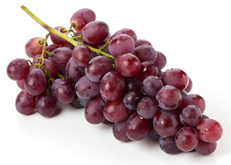 Fototapeta premium A bunch of fresh purple grapes on a white background.