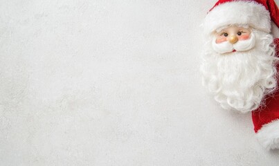 Santa Claus figurine on a white background with red hat and coat