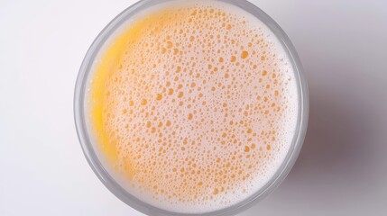 Fresh Bubbles of Craft Beer in Clear Glass on White Surface