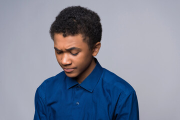 Surprised African American teenager is agitated