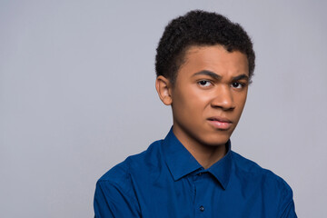 Obraz premium African American teenager is watching disdainful.