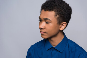 Obraz premium African American teenager in shirt is in turmoil.