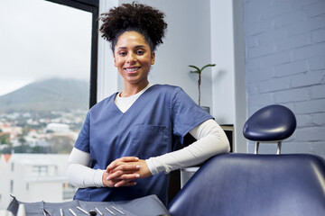 Confident Female Dentist Poses in Modern Dental Office With Professional Tools
