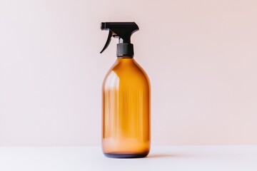 Amber spray bottle stands elegantly against soft, muted backgrou