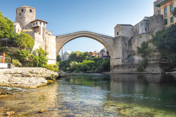 The Stari Most bridge, old bridge on Neretva river in Mostar town, Bosnia and Herzegovina, Europe. Iconic stone bridge arching over a river, blending history and architecture with natural beauty.