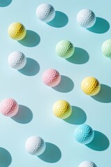 Fototapeta premium A group of golf balls placed on a blue surface, great for sports or leisure images