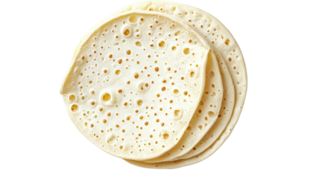 Traditional Laffa bread stacked on a plain background highlighting texture and preparation style in Middle Eastern cuisine