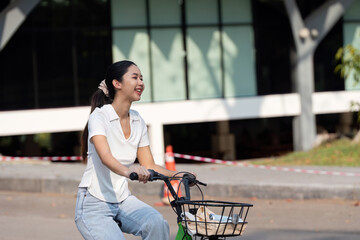 Sustainable Travel and Cycling Joy. A woman cycling enthusiastically in a contemporary urban area.