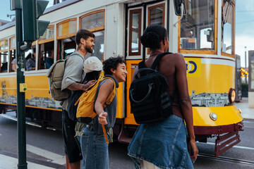 Tourists waiting to board lisbon tram 28 in portugal