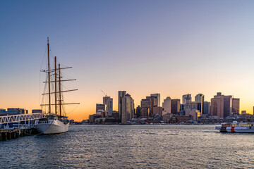 Naklejka premium View of Boston skyline and skyscrapers in late evening of February winter seen from Piers Park in Boston, MA