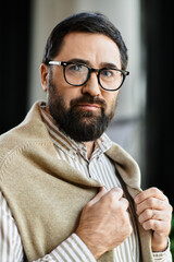 Elegant elderly gentleman showcasing style in a sunlit indoor setting