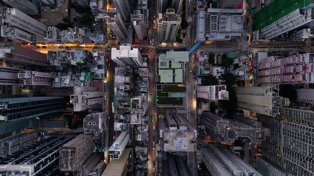 Sai Ying Pun, Hong Kong: Cinematic aerial overhead drone footage of the nightfall over the Sai Ying Pun residential district in Sai Wan in Hong Kong island