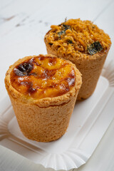 angle view two cup egg tarts at vertical composition