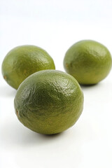 Fresh limes, isolated on white background