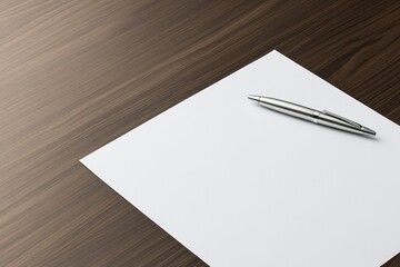 Blank sheet rests on polished wood surface alongside elegant sil
