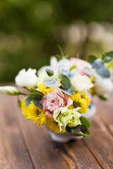 Bright bouquet in vintage vase outdoors
