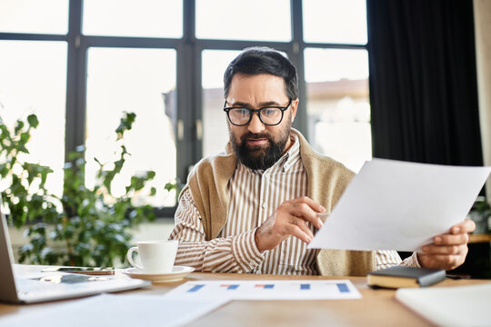 Elderly man reviews documents at a cozy workspace surrounded by plants and natural light - Powered by Adobe