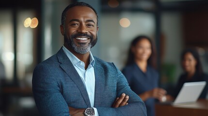 Business professional smiling confidently in a modern office setting during work hours with colleagues in the background