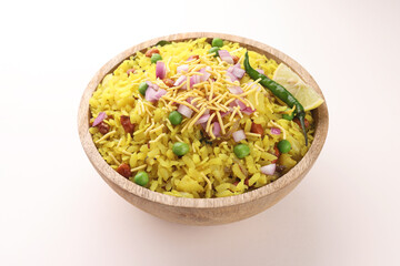 Poha with sev and raw chopped onions garnishing