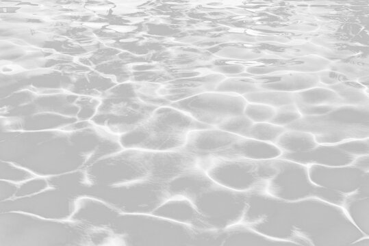 Real water ripples texture, sun reflections swimming pool water pattern overlay, isolated on white or transparent background png cut out