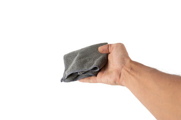Male hand holding a cleaning cloth or dust rag isolated no background