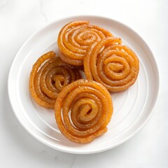 Fototapeta premium gur jalebi on white plate on white background 