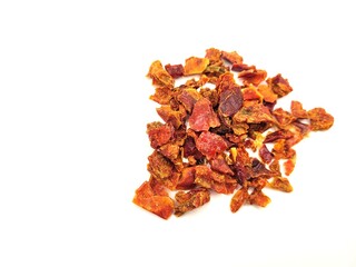 Dried pile of red paprika on a beautiful, white background.