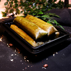 Sweet Ketimus is made from cassava wrapped in green banana leaves, is a traditional Indonesian...