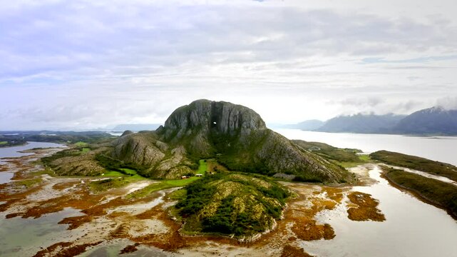 The drone time-remaps from a close-up of Torghatten's iconic hole to a stunning wide view of the entire mountain, framed by the breathtaking Norwegian landscape.