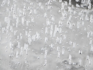 Ice texture  of frozen air bubbles floating up, close up