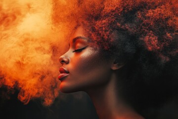 Woman with majestic afro hairstyle surrounded by vivid orange smoke in a dramatic artistic portrait