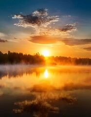 Fototapeta premium Stunning sunrise over a calm lake with mist and vibrant colors. 