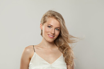 Happy smiling woman. Female model with blond hairstyle and clean skin, facial treatment, skin care and beauty concept