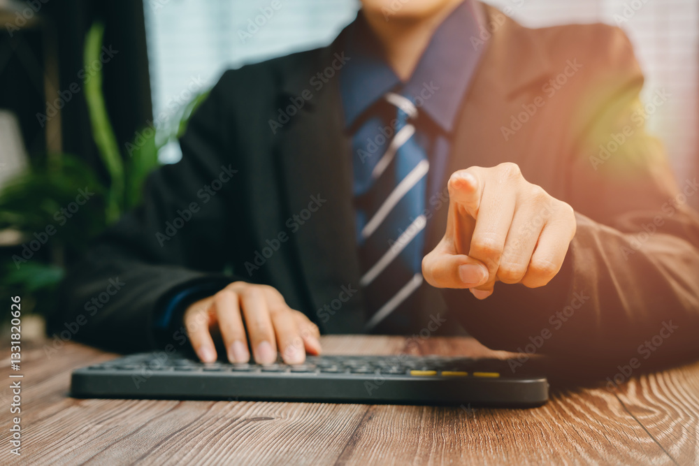 Aufkleber businessman pointing at computer keyboard while working on modern office desk environment, business 