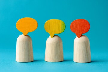Colorful wooden figures representing conversation on a vibrant blue background