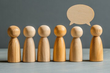 Wooden figures engaging in conversation with one figure speaking and others listening thoughtfully