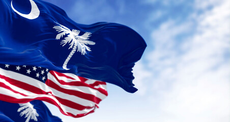 Naklejka premium South Carolina state flags waving with the US flag