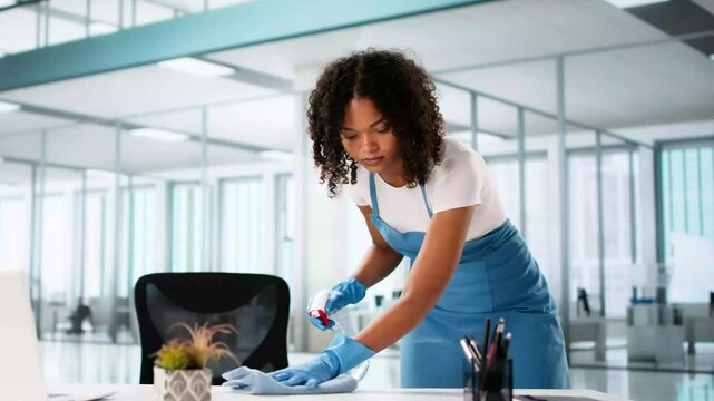 Janitor Cleaning Office Desk