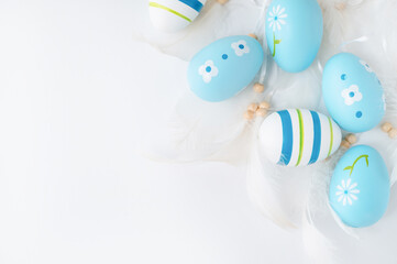 Festive composition with easter eggs on light background. Happy easter concept with copy space