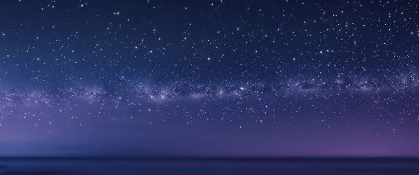 A starry night sky with a long line of stars.