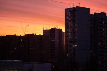Urban Sunset with High-Rise Buildings and Warm Sky