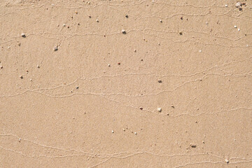 Beach sand background. Close up of abstract tropical beach sand texture background. Natural sand stone texture background perfect for design projects or summer designs. Mock up.