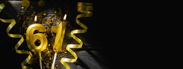 Golden candles number sixty-one burning brightly, celebrating 61st birthday anniversary. Festive...