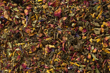 Various kinds of dry herbal flowers tea and green tea. View from above. Dry tea leaves texture and...