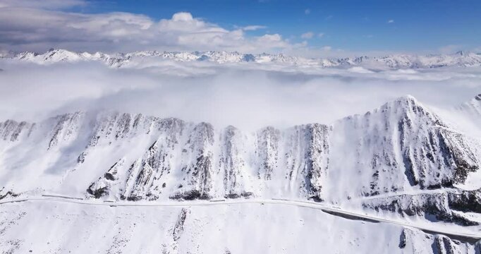 Aerial time lapse of Snow mountain of Jiajinshan in Sichuan China with clouds and mist, amazing nature landscape