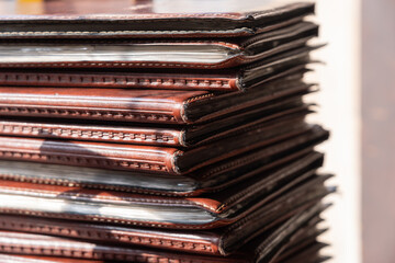 Restaurant paper menus books in leather covers